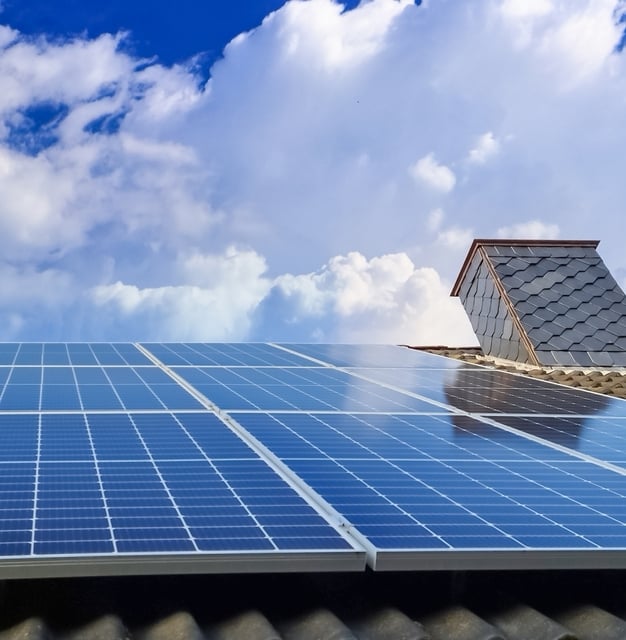 small-vecteezy_solar-panels-producing-clean-energy-on-a-roof-of-a_53786000_small